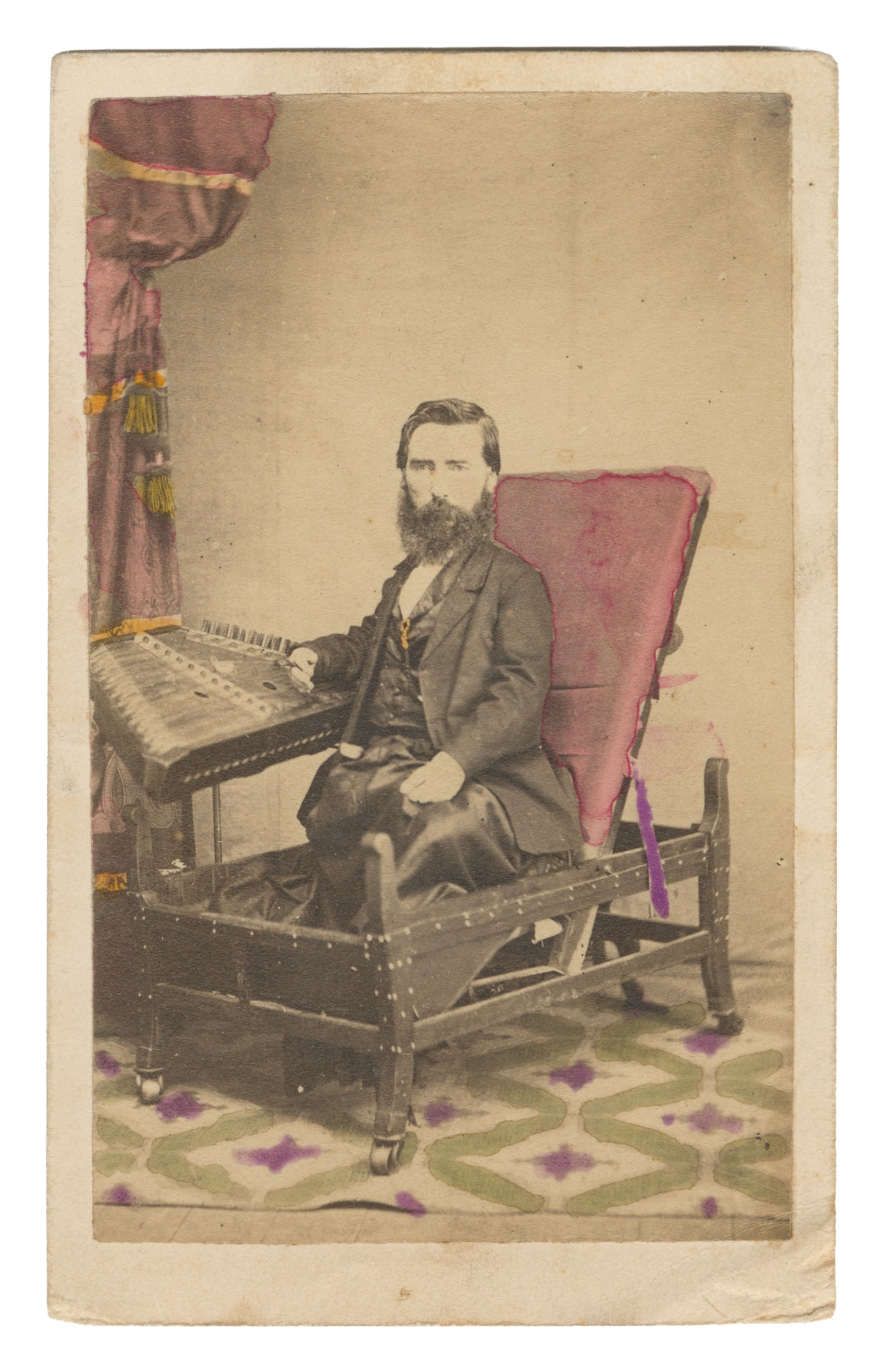 CDV of S. Hunter Smith, "The Dulcimer Man." Abingdon, IL: Wm. Johnston, 1860s.: CDV of S. Hunter Smith, "The Dulcimer Man." Abingdon, IL: Wm. Johnston, 1860s. Hand-tinted CDV of the performer in his specially designed chair alongside his dulcimer. Verso is inscribed with a short 