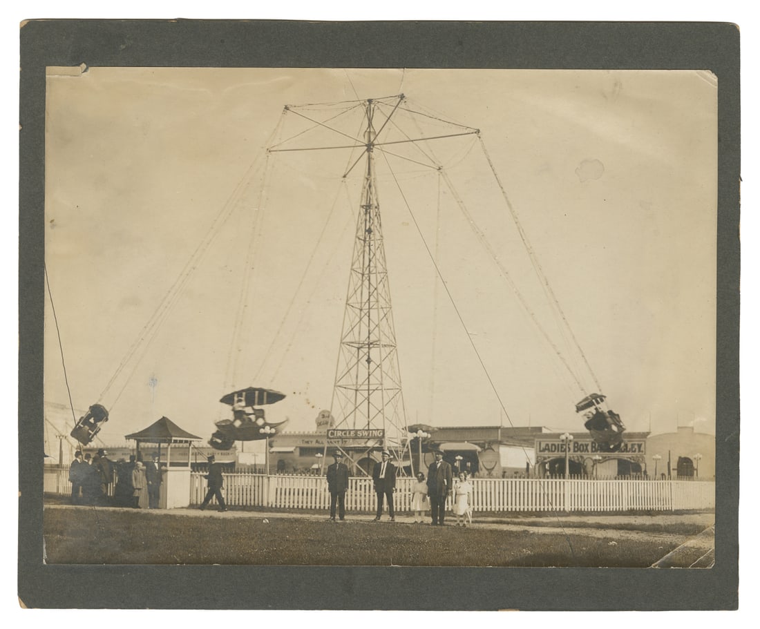 [CARNIVAL]. Mounted Photograph of a Circle Swing Carnival Ride. Circa early 20th century. (1 of 1)