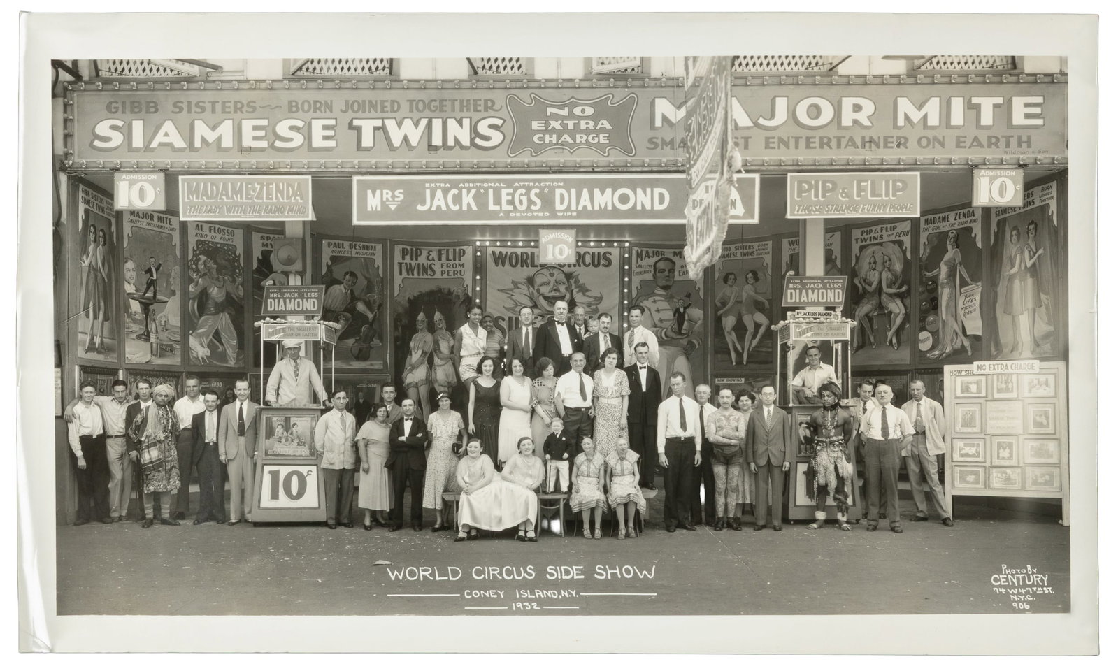 KELTY, Edward J. (1888 - 1967). World Circus Side Show. Coney Island, NY. 1932.: KELTY, Edward J. (1888 - 1967). World Circus Side Show. Coney Island, NY. 1932. New York: Century. Silver print panoramic photograph of the Coney Island sideshow cast, surrounded by painted signs and 