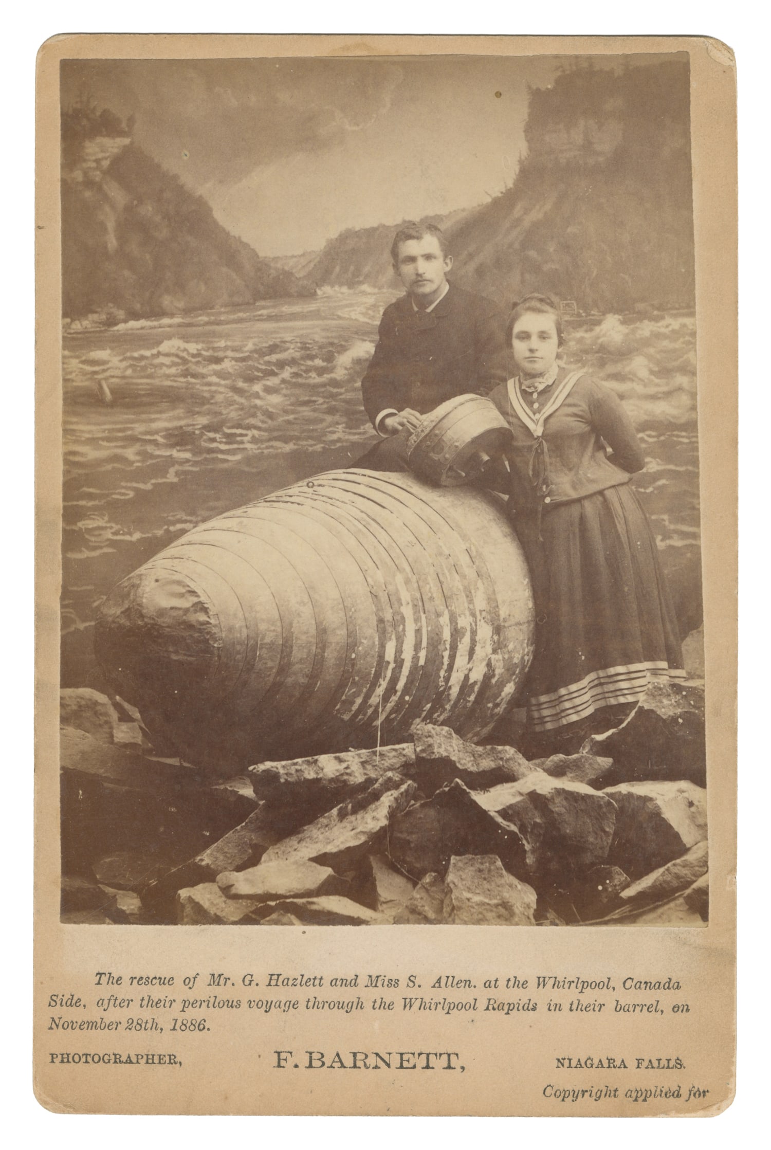 Cabinet card of George Hazlett and Sadie Allen beside the barrel used to navigate Whirlpool Rapids: Cabinet card of George Hazlett and Sadie Allen beside the barrel used to navigate Whirlpool Rapids at Niagara Falls. Niagara Falls, NY: F. Barnett, 1886. Text below reads "The rescue of Mr. G.