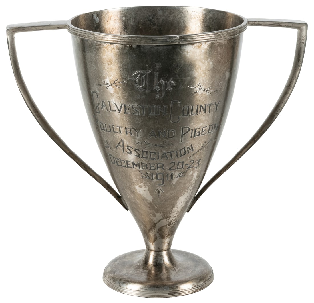 Budweiser Cup / Galveston County Poultry and Pigeon Association 1911 trophy.: Budweiser Cup / Galveston Country Poultry and Pigeon Association 1911 trophy. A metal (likely silverplate) trophy presented to the "highest scoring chicken" in the show, awarded to a Henry Thomas. 10