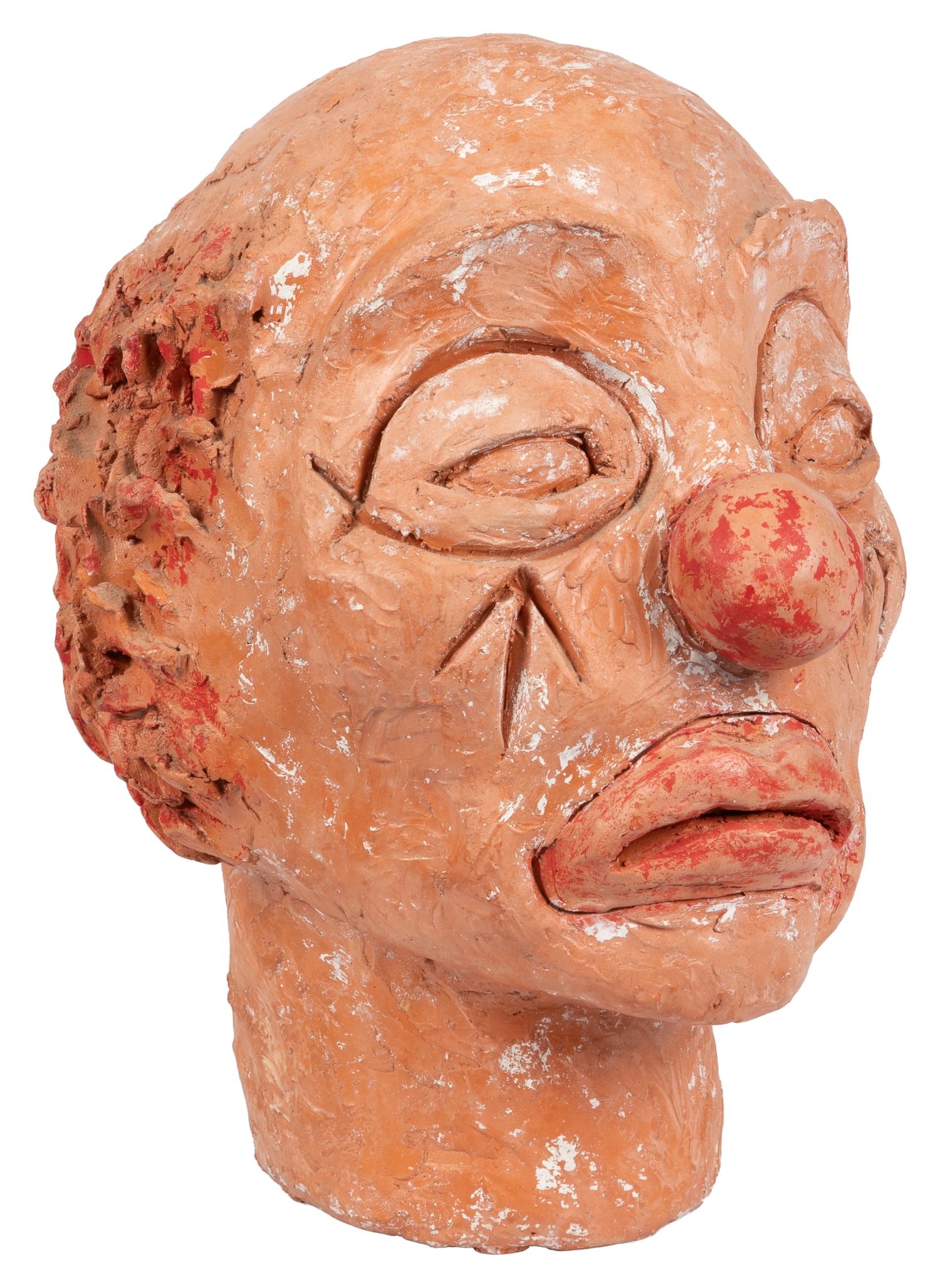 [ART]. Hand-Sculpted Ceramic Clown Head. Circa late 20th century.: [ART]. Hand-Sculpted Ceramic Clown Head. Circa late 20th century. Sculpted clown head in thrown clay with red hand-painted details highlighting the hair, nose, and lips. 9 x 7 1/2 x 7".