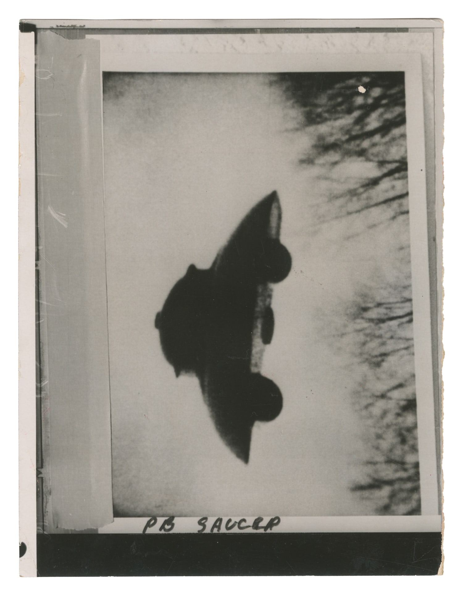 Flying Saucer. Copy print photo, inscribed PB Saucer.: Flying Saucer. Copy print photo, inscribed PB Saucer. Various stamped dates 1968, 1976, 1988. Silver gelatin print on RC paper. Inscribed: "Also see Mrs. Madeline Rodeffer" and "W-14-0744 ZR."