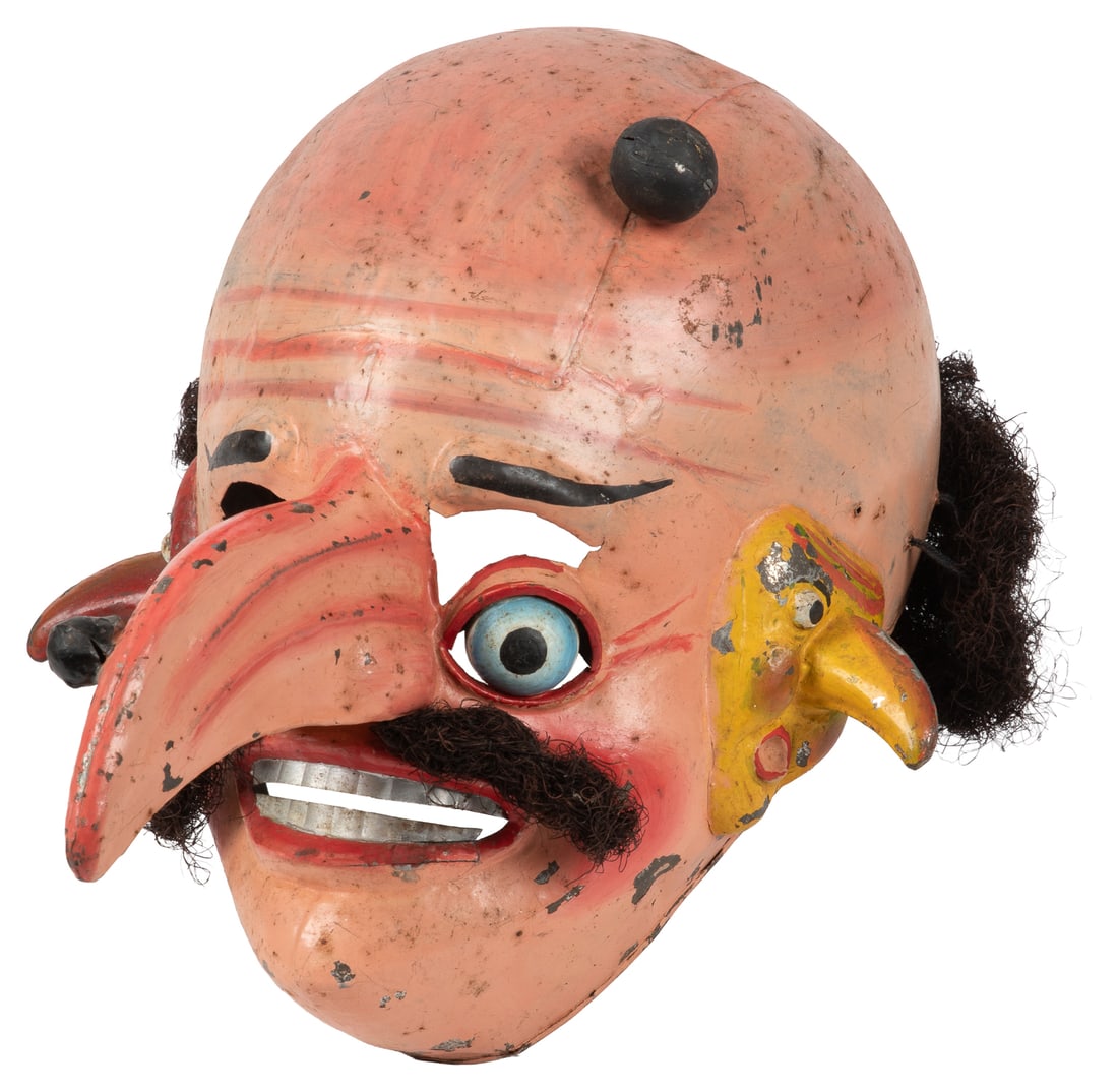 Painted Asian-Style Tin Mask of a Three-Faced Demon. [N.p., ca. 20th century].: Painted Asian-Style Tin Mask of a Three-Faced Demon. [N.p., ca. 20th century]. Painted tin mask of a demon with a man's face with a huge nose and two large moles, and two small faces at each side of h