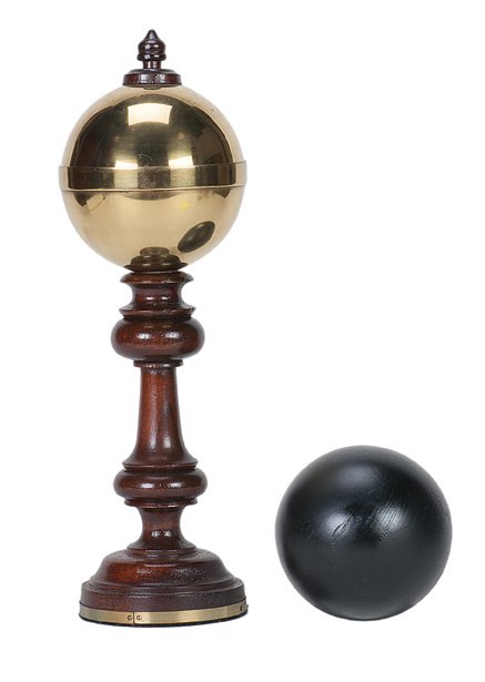 28. Cannonball Vase. Douglas-Wane, ca. 1997.: 28. Cannonball Vase. Macomb Illinois, Douglas-Wane, ca. 1997. A small cannonball vanishes from a handsome brass and turned wood vase, and reappears elsewhere. Vase 12 ¾” high. Light wear to paint o