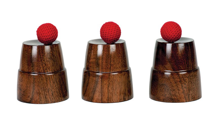 61. Cups and Balls. Mark Teufel, ca. 2000: 61. Cups and Balls. California, Mark Teufel, ca. 2000. Set of three turned wooden cups and four crocheted cork balls for the classic sleight-of-hand trick. Cups stand 3 ½” high. Very good. 128