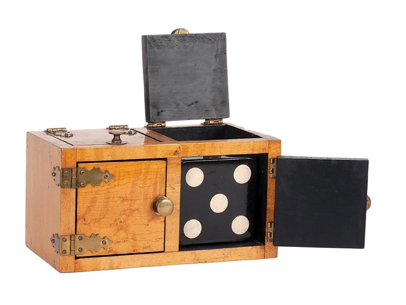 66. Die Box. New Haven, Petrie & Lewis, ca. 1930. : 66. Die Box. New Haven, Petrie & Lewis, ca. 1930. Handsome wooden die box for the popular sucker effect. Finely crafted of bird’s eye maple. Black die with white spots. 7 ½ x 4 x 4”. Fine conditi