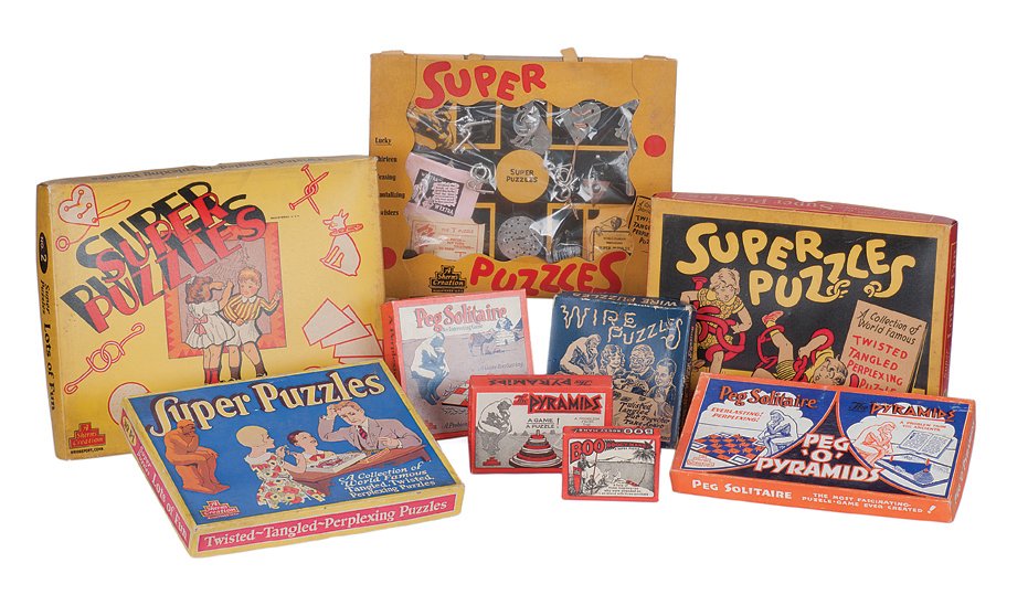 165. Group of 12 Sherms-made Puzzle sets and games.: 165. [Puzzles] Group of 12 Sherms-made Puzzle sets and games. Bridgeport, Sherms Inc., 1930s – 50s. Including Super Puzzles, Wire Puzzles, Peg Solitaire, the Boo Boogy Mans Super Puzzle, Pyramids (t