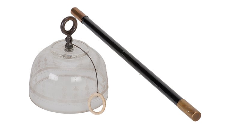 187. Spirit Bell. Berlin, Conradi-Horster, ca. 1919.: 187. Spirit Bell. Berlin, Conradi-Horster, ca. 1919. Glass bell with ringer hangs from the magician’s wand. It rings when questions are asked of it: once for yes, twice for no. Etched glass bell wit