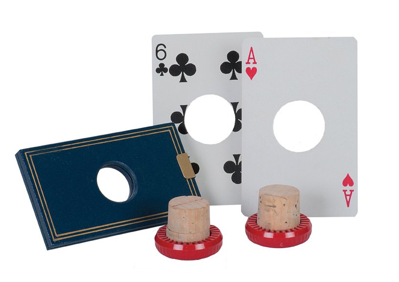 329. Card Through Cork. Eddy Taytelbaum, ca. 1968.: 329. Card Through Cork. Holland, Eddy Taytelbaum, ca. 1968. A cork placed in a hinged wooden holder is penetrated by a card; the card is then shown whole. Wooden frame 3 ½ x 2”. Very good.