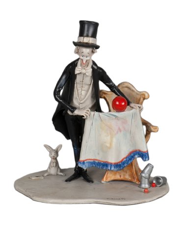 Moretto, Toni. Magician and Floating Ball sculpture.: Moretto, Toni (Italian, 1929 – 2011). Magician and Floating Ball sculpture. Top hat and tail-clad magician performs the Zombie floating ball effect while standing next to a chair; a rabbit looks on.