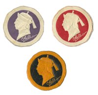 Three embossed Okito paper seals.: Okito (Tobias Bamberg). Three embossed Okito paper seals. American, ca. 1935. Including examples in red/white, purple/white, and black/orange. 32mm. Two mounted to cardstock, the other curling and wor