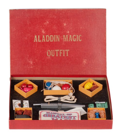 Aladdin Magic Set. New Haven, Petrie & Lewis, ca. 1930.: Aladdin Magic Set. New Haven, Petrie & Lewis, ca. 1930. With turned wooden props, including a marble vase, ball vase, imp bottle, hank pull, wand, jumping peg, and more. With instructions. 15 x 11 x 2