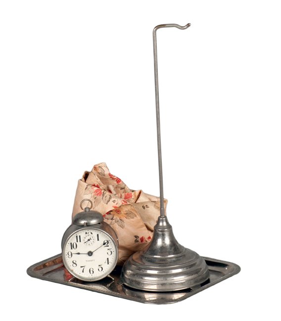Vanishing Alarm Clock. New Haven Connecticut, P&L.: Vanishing Alarm Clock. New Haven Connecticut, Petrie & Lewis, ca. 1929. A ringing clock covered by a cloth vanishes from a nickel plated stand. Early model with plain feet on ringing stand and nickel-