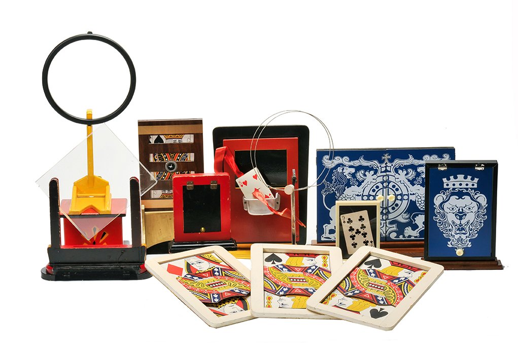 Group of 10 card magic props.: [Card Magic] Group of 10 card magic props. Including Card in Balloon (two different models), jumbo Find the Lady Cards, Television Card Frame, Card Rise Chest (Grant), card frames, and others. Sizes v