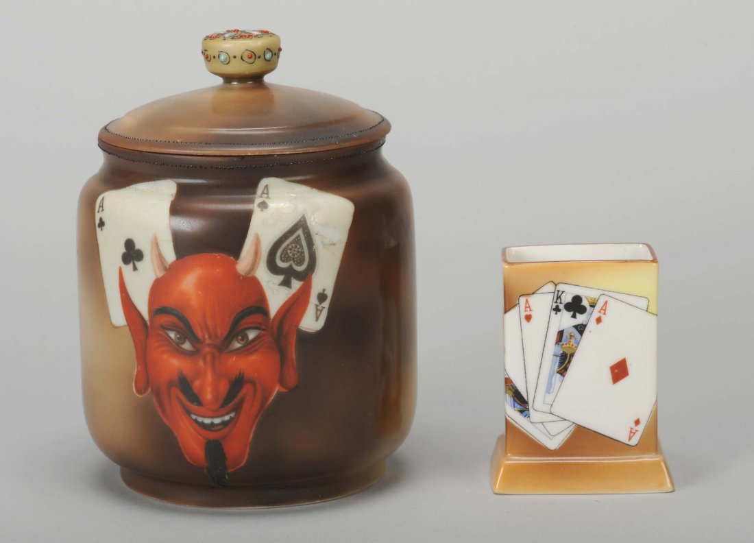 Humidor and Match Box Holder. Porcelain humidor with: Humidor and Match Box Holder. Porcelain humidor with hand painted Nippon playing cards and devil face, 5 ½”, Exc; and a hand painted Nippon match box holder, 3”, Exc.