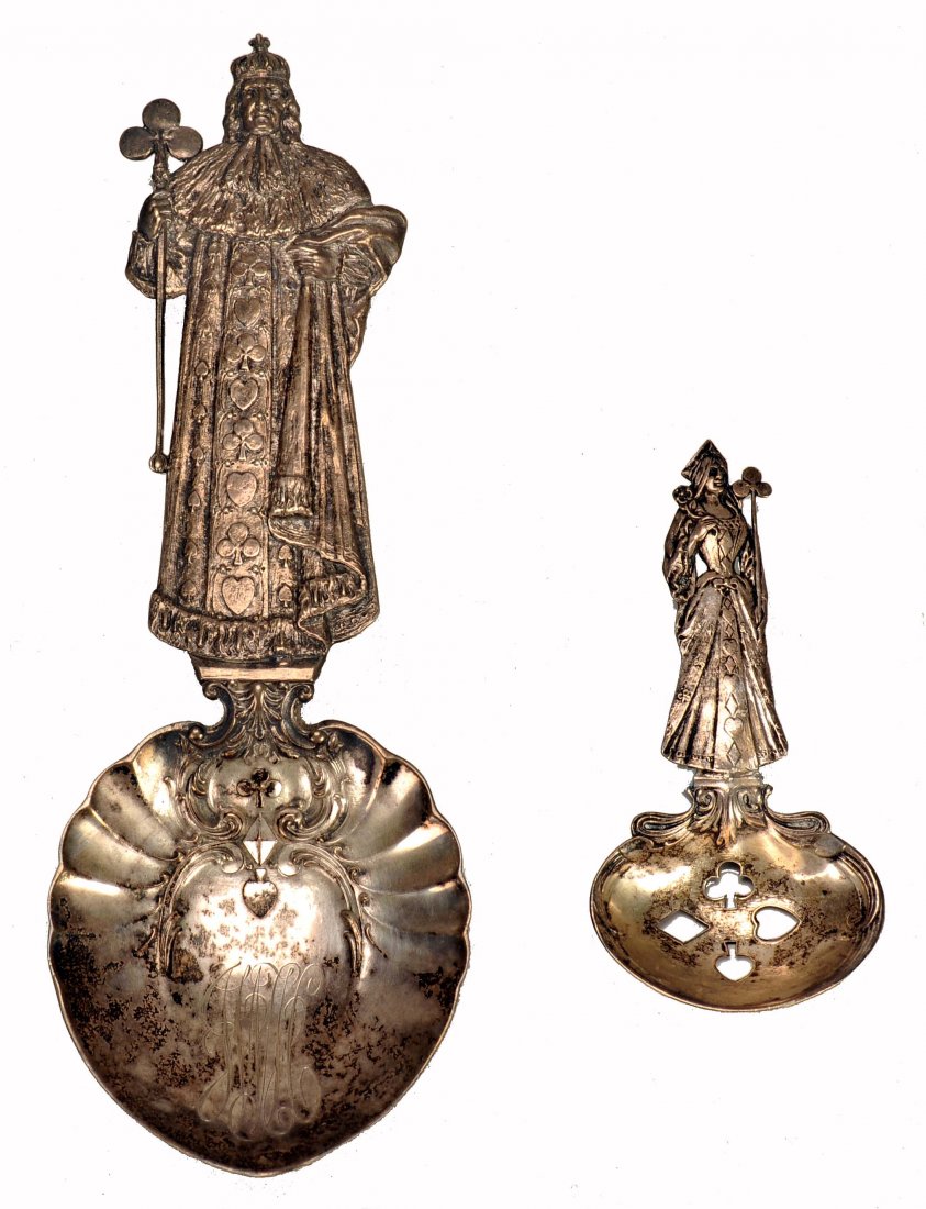 Two Heavily Embossed Serving Spoons with Card Symbols.: Two Heavily Embossed Serving Spoons with Card Symbols. Ca. 1900. With religious theme. 1) Man in heavily embossed robe holding a scepter with club handle, 9 x 3” (at bowl). NM. 2) Woman in heavily e