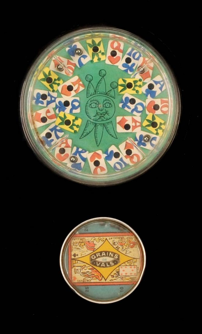 Two Hand Held Puzzle games. French Hand Held Puzzle: Two Hand Held Puzzle games. French Hand Held Puzzle Game with Playing Card and Advertising. (1) France, ca. 1910. Get the balls in the corners of the playing card. Puzzle advertises a laxative to be t
