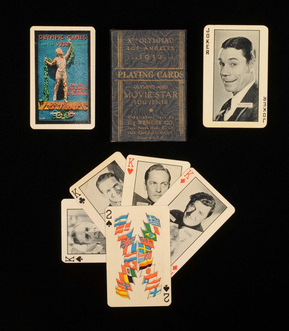 Xth Olympiad, Los Angeles, CA Playing Cards. P.G.: Xth Olympiad, Los Angeles, CA Playing Cards. P.G. Wenger, 1932. 52 + J + OB, Exc. Courts have photos of movie stars, Aces photos of buildings in L.A., Olympic village, and number cards flags of all na