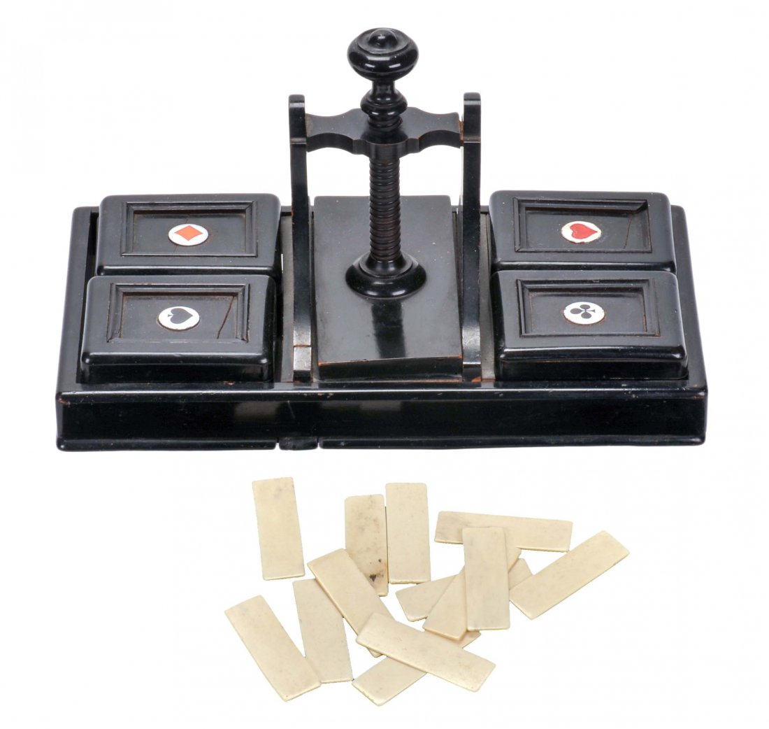 Ebony Card Press. English, ca. 1900. With four boxes to: Ebony Card Press. English, ca. 1900. With four boxes to hold bone markers (included). Lid of heart box damaged and heart suit symbol repainted.
