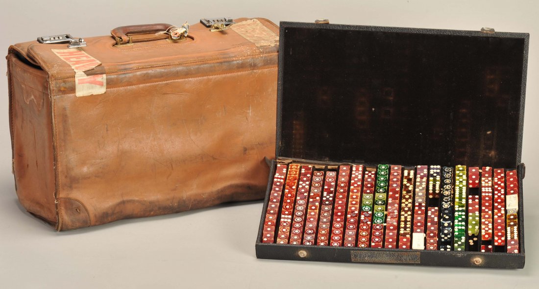 Dice Hustler’s Crooked Dice collection. Including five: Dice Hustler’s Crooked Dice collection. Including five trays of crooked dice in the hustler’s own suitcase. Each tray filled with tops (mis-spotted) and weights in a variety of sizes, colors and s
