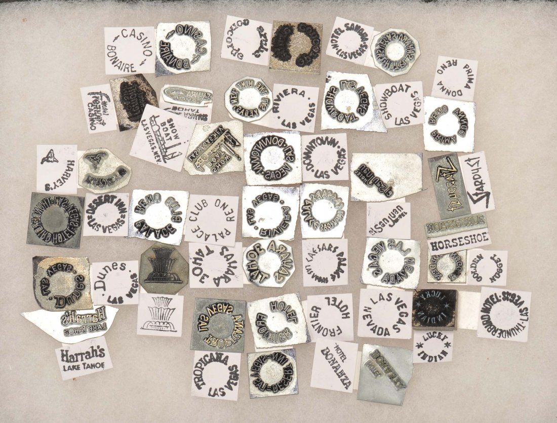 Crooked Dice Stamping Dies. American, contemporary.: Crooked Dice Stamping Dies. American, contemporary. Collection of metal stamps used to manufacture crooked dice with casino logos. Many well-known casinos represented. In a small display case, with ex
