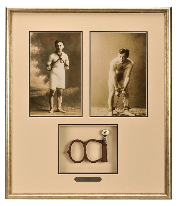 Houdini's English Regulation Cuffs. “Irish-8”-style: Houdini English Regulation Cuffs. “Irish-8”-style handcuffs with key, owned by Harry Houdini. Framed in a shadowbox with two reproduction photographs of Houdini to an overall size of 21 x 24 ½”