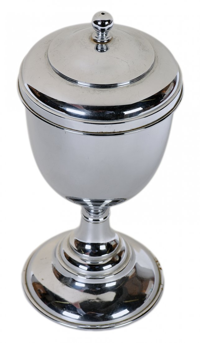 Bran Vase. Kansas City, Donald Holmes, ca. 1920.: Bran Vase. Kansas City, Donald Holmes, ca. 1920. A quantity of paper shavings or bran transforms into a live guinea pig when placed in the attractive metal vase. 10” high. Very good.