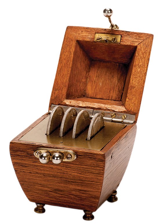 Coin Casket. Lake Forest, John McKinven, ca. 1990.: Coin Casket. Lake Forest, John McKinven, ca. 1990. Four coins placed inside this wooden casket disappear one by one each time the lid is opened and closed. Modeled after the Martinka and Otto Maurer c
