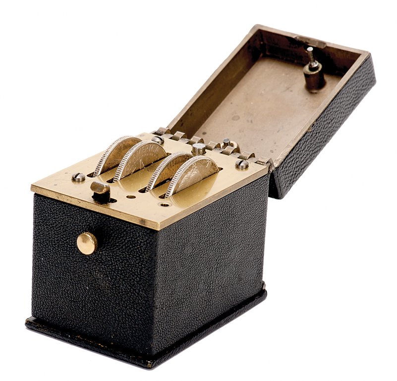 Coin Casket. New York, Charles Kalish, ca. 1976.: Coin Casket. New York, Charles Kalish, ca. 1976. Four coins vanish one at a time by opening and closing the lid. Finally, all four reappear simultaneously. Machined brass, covered with tooled black le