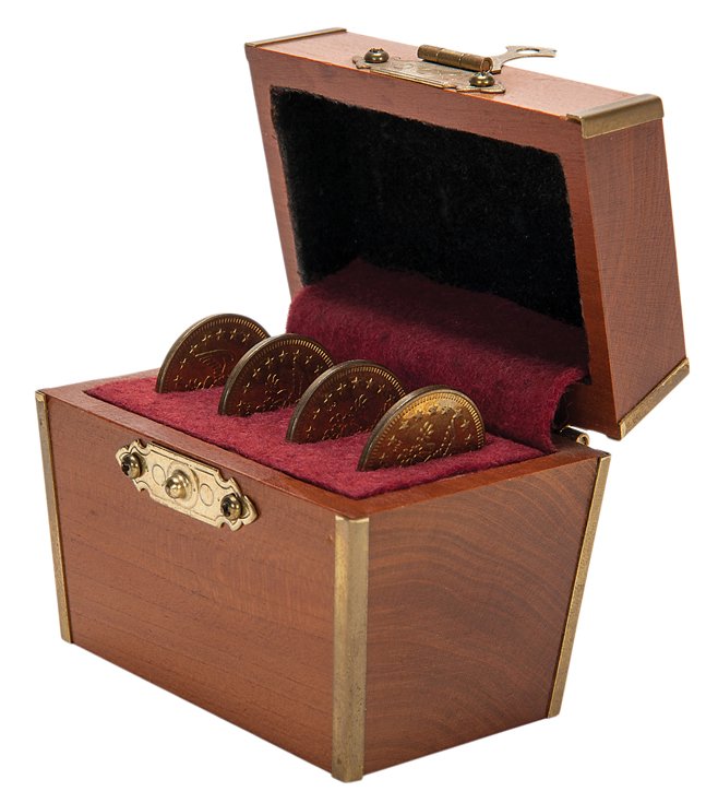 Miraculous Coin Casket. Macomb Illinois, Douglas-Wayne,: Miraculous Coin Casket. Macomb Illinois, Douglas-Wayne, ca. 1995. Four coins vanish one at a time from inside a small hardwood chest. 3 x 2 x 2 ½”. Very good.