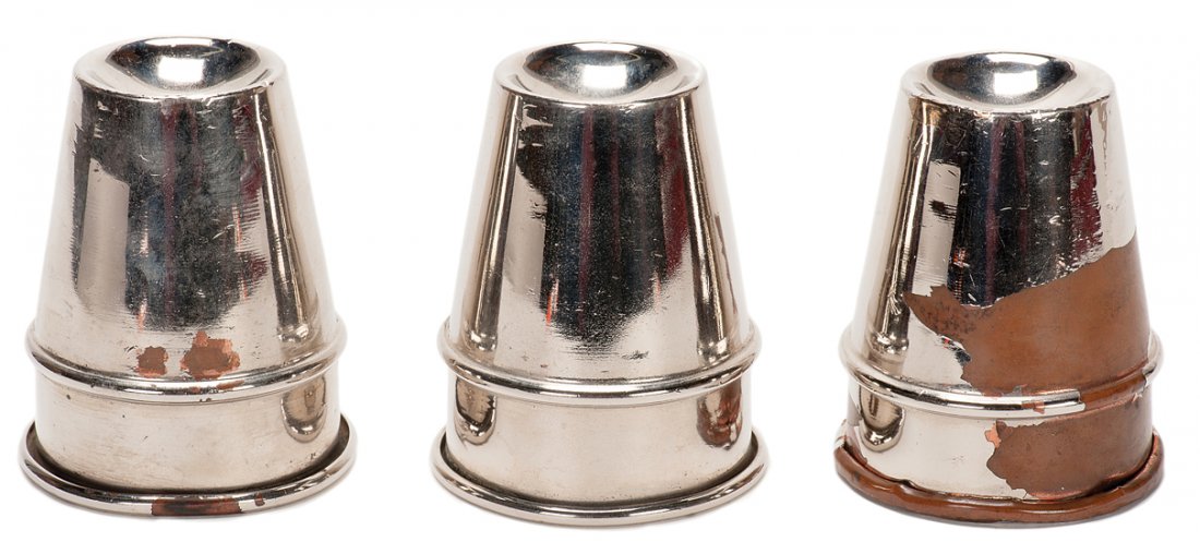 Cups and Balls. New Haven, P&L, ca. 1947. Set of three: Cups and Balls. New Haven, P&L, ca. 1947. Set of three chrome plated brass cups for the traditional Cups and Balls trick. In a cloth carrying case. Significantly worn and damaged, but intact; chrome p
