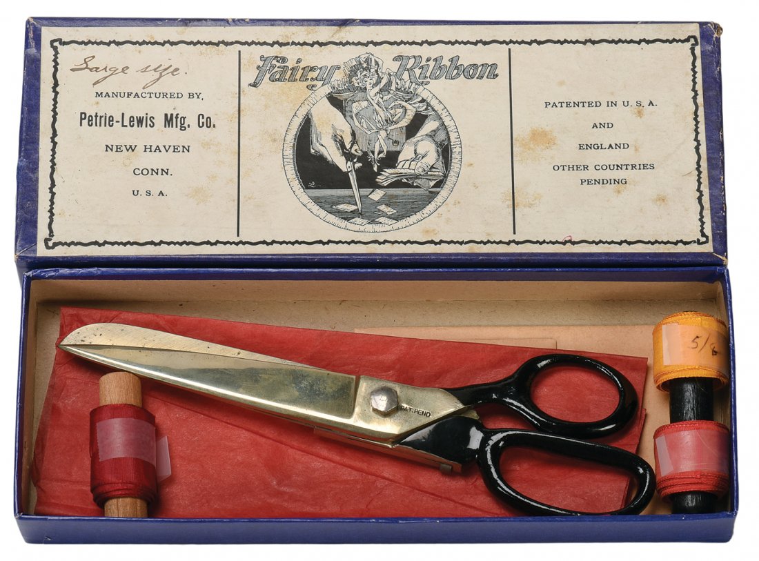 Fairy Ribbon Shears. New Haven Connecticut, P&L.: Fairy Ribbon Shears. New Haven Connecticut, P&L, ca. 1930. Specially-crafted scissors which allow the magician to cut through a strip of satin ribbon, then restore it. 7 ¼” long. With facsimile ins