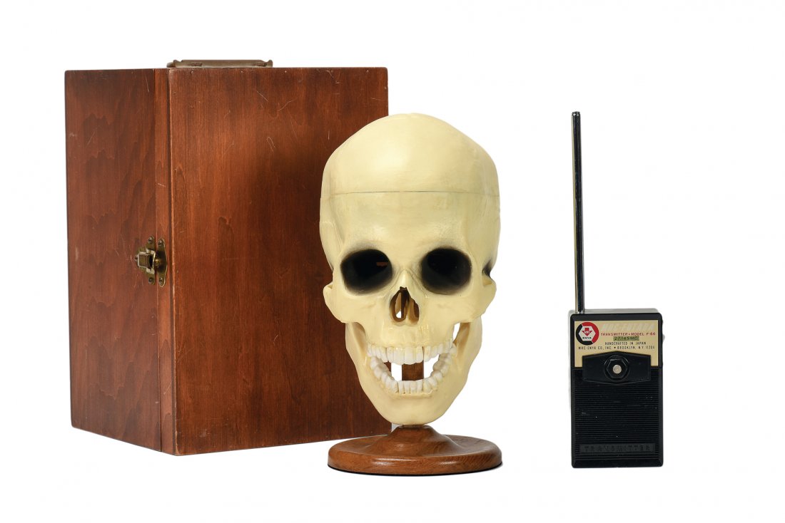 Radio-Controlled Talking Skull. Arturo (Abbott’s).: Radio-Controlled Talking Skull. Colon, Arturo (Abbott’s Magic), ca. 1972. A faux human skull on a short wooden stand clicks out answers to questions with its jaw, as if haunted by a ghost. With wood