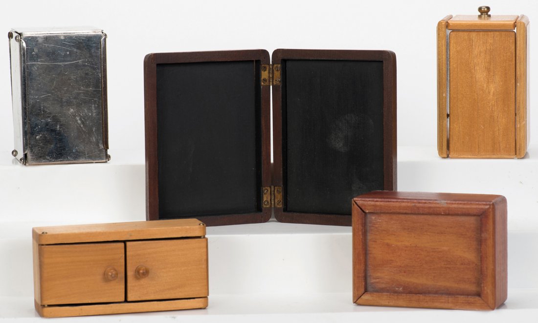 Group of five close-up magic props.: [Miscellaneous – Close-up] Group of five close-up magic props. Various manufacturers, 1940s – 70s. Including two Wonder Boxes (one hallmarked Demon Magic, the other by Mikame); a Rattle Box; Flap 