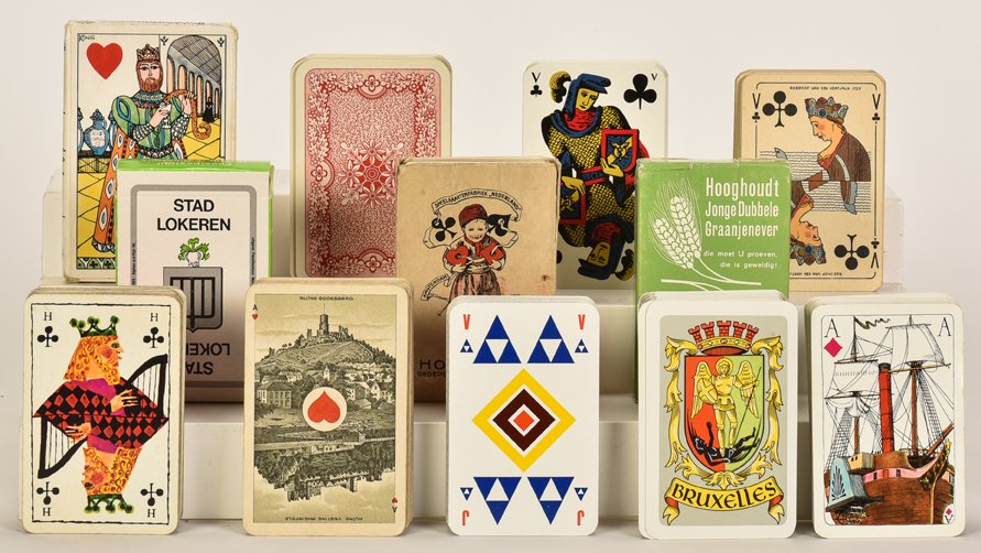 A Group of 21 Belgian Decks of Playing Cards. Including: A Group of 21 Belgian Decks of Playing Cards. Including “Great Mogul”, Nederland Spielkarten, Hollandia, Constantia, and others. Condition and completeness varies.