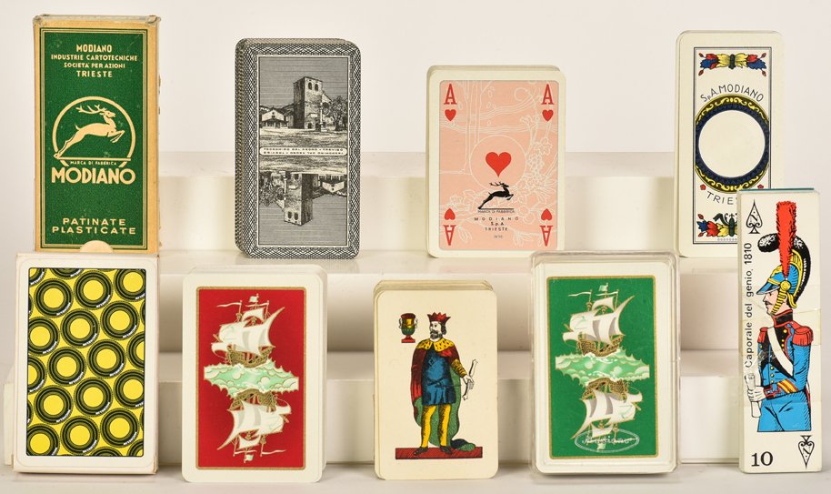 Eleven Vintage Decks. Including E. Pignalosa, Modiano,: Eleven Vintage Decks. Including E. Pignalosa, Modiano, advertising and more. Condition and completeness varies.