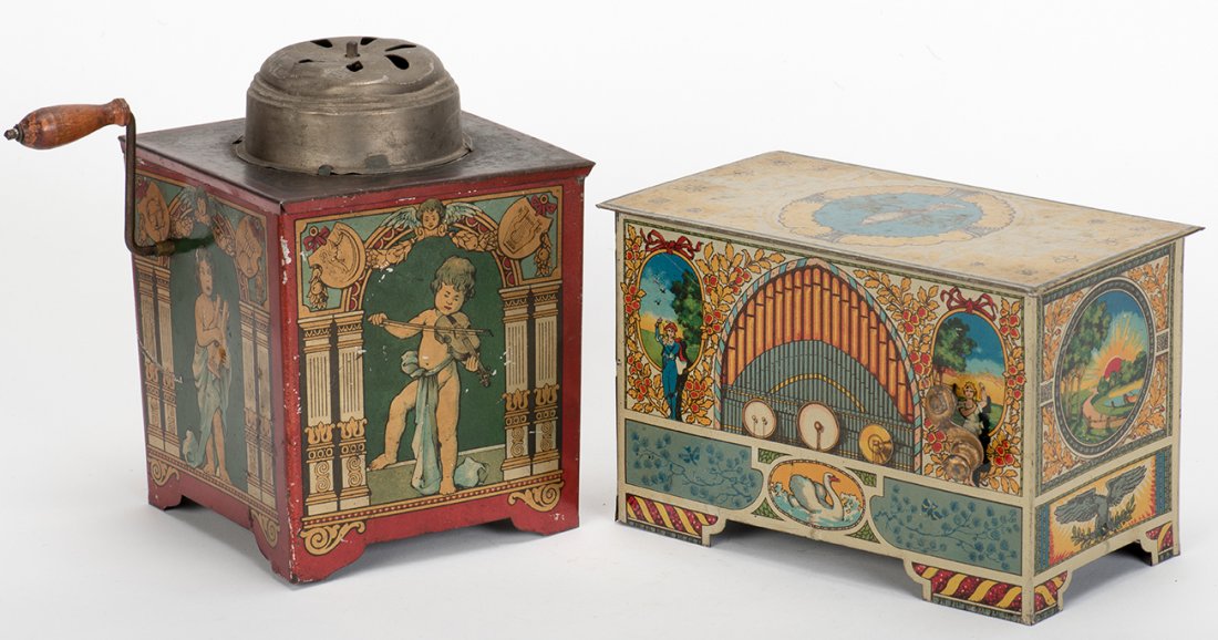 895. Two Mechanical Music Organ Toys. German, ca. 1919.: 895. Two Mechanical Music Organ Toys. German, ca. 1919. Lithographed tin organs with crank handle. Attractive graphics. Scratched and worn finishes; good. Working.