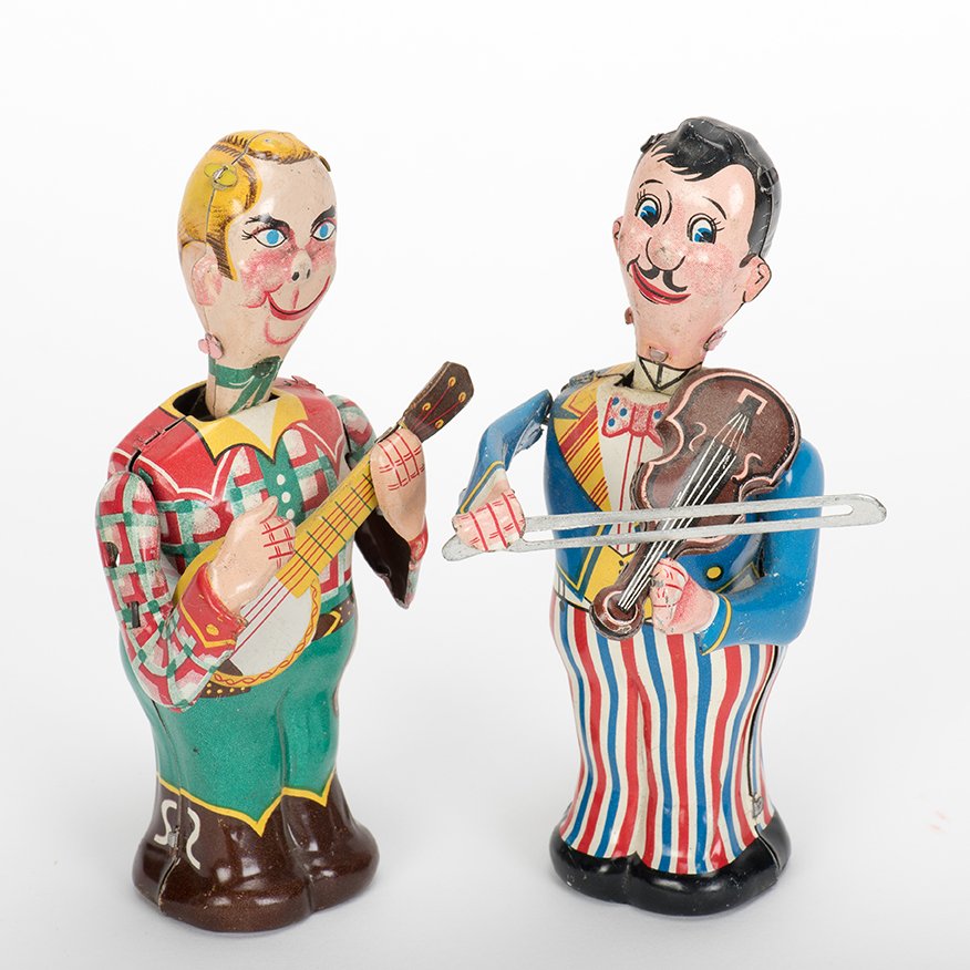 951. [Wind-Up] Two Vintage Wind-Up Toys. Japan, TPS,: 951. [Wind-Up] Two Vintage Wind-Up Toys. Japan, TPS, ca. 1950s. Including a wind-up banjo player and wind-up violinist. Litho tin. 5 ½” tall each. Both in very good condition and working.