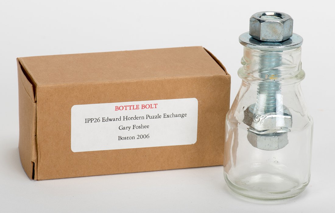 984. Bottle Bolt Puzzle Bottle. Issaquah, Gary Foshee,: 984. Bottle Bolt Puzzle Bottle. Issaquah, Gary Foshee, 2006. Impossible bottle with a nut and bolt inside – though the nut is too large to pass through the neck of the bottle. With original box. 3 �