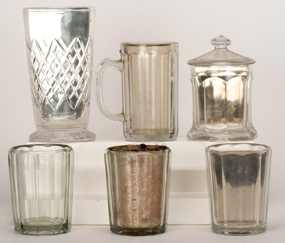 [Glassware] Six Magicians’ Glasses and Vases. Kansas: [Glassware] Six Magicians’ Glasses and Vases. Kansas City, Donald Holmes, ca. 1930. Including a mirror jar, matching straight glass, mirror glass, mirror vase, double-walled beer glass, and unusual 