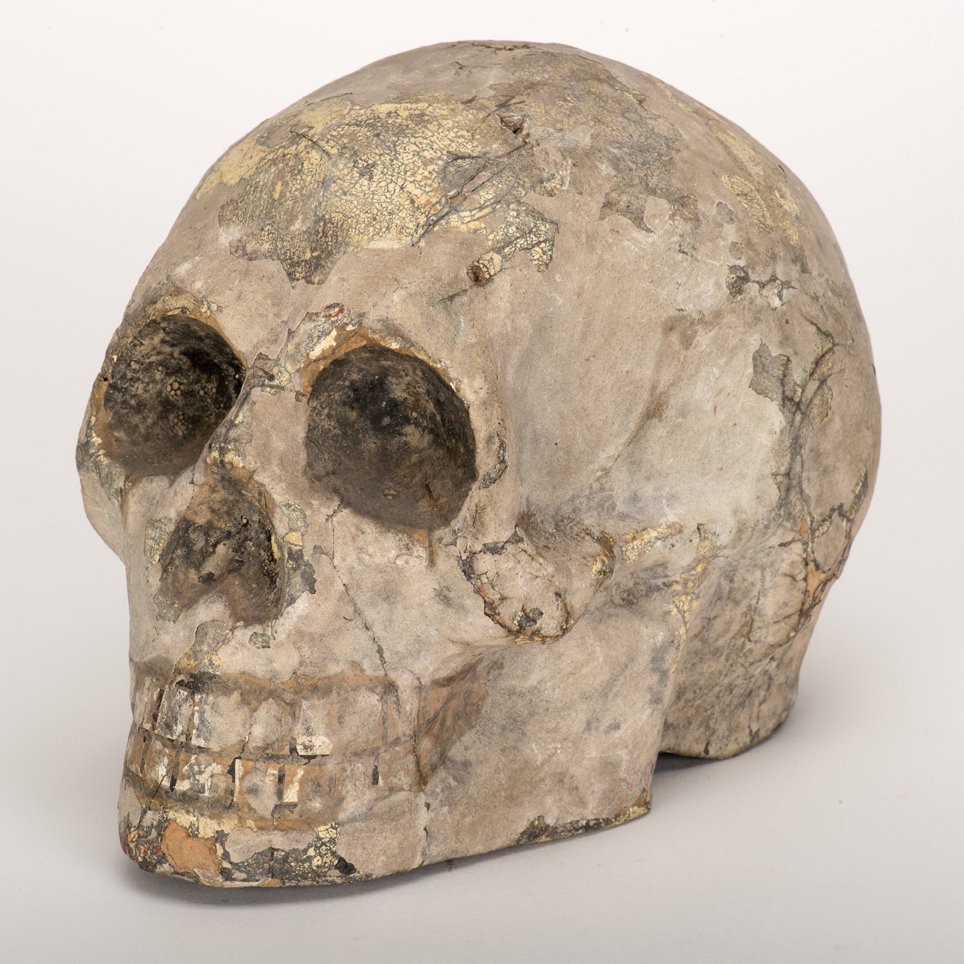 Vintage Magic Production Skull. German or American,: Vintage Magic Production Skull. German or American, Conradi or Thayer [?], ca. 1920s. Hand-crafted rigid papier-mch model with painted teeth. Two tiny holes drilled at top for wire or thread. Approx. 