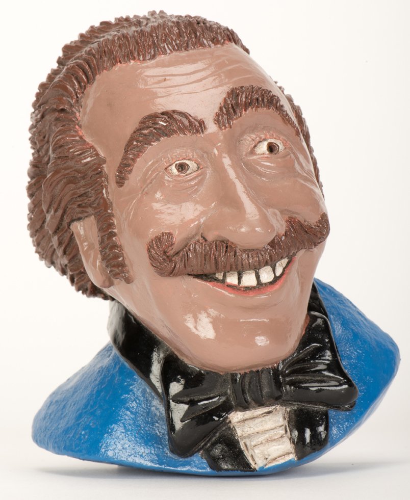 Duke Stern Hanging Bust. Niagara Falls: Rob Allen,: Duke Stern Hanging Bust. Niagara Falls: Rob Allen, 1984. Ceramic caricaturist-style hanging bust (5 ” long) of Stern in blue tuxedo and bowtie. Signed twice, dated, and numbered by the artist. Some 