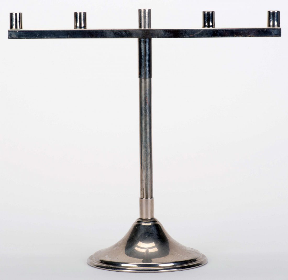 Cigarette and Candle Combination. New Haven: Petrie &: Cigarette and Candle Combination. New Haven: Petrie & Lewis (P&L), ca. 1940. Nickel-plated stand (approx. 10 x 10") with round base, prepared to aid the magician who produces and vanishes five cigaret