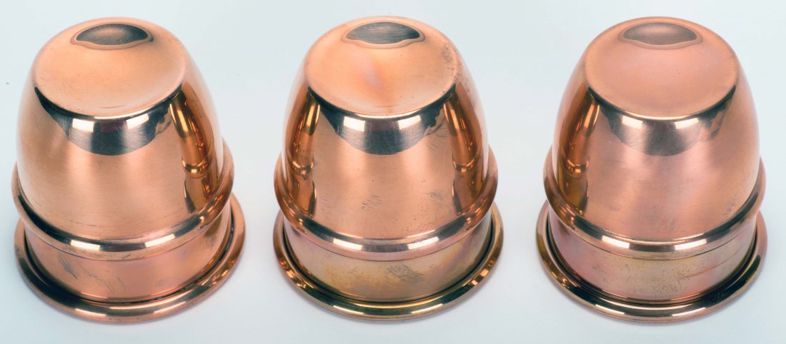 Cups and Balls. RNTII, ca. 2005. Set of three spun: Cups and Balls. RNTII, ca. 2005. Set of three spun copper cups (3 x 2 7/8") with beaded shoulders, brushed satin interior finish. Very good.