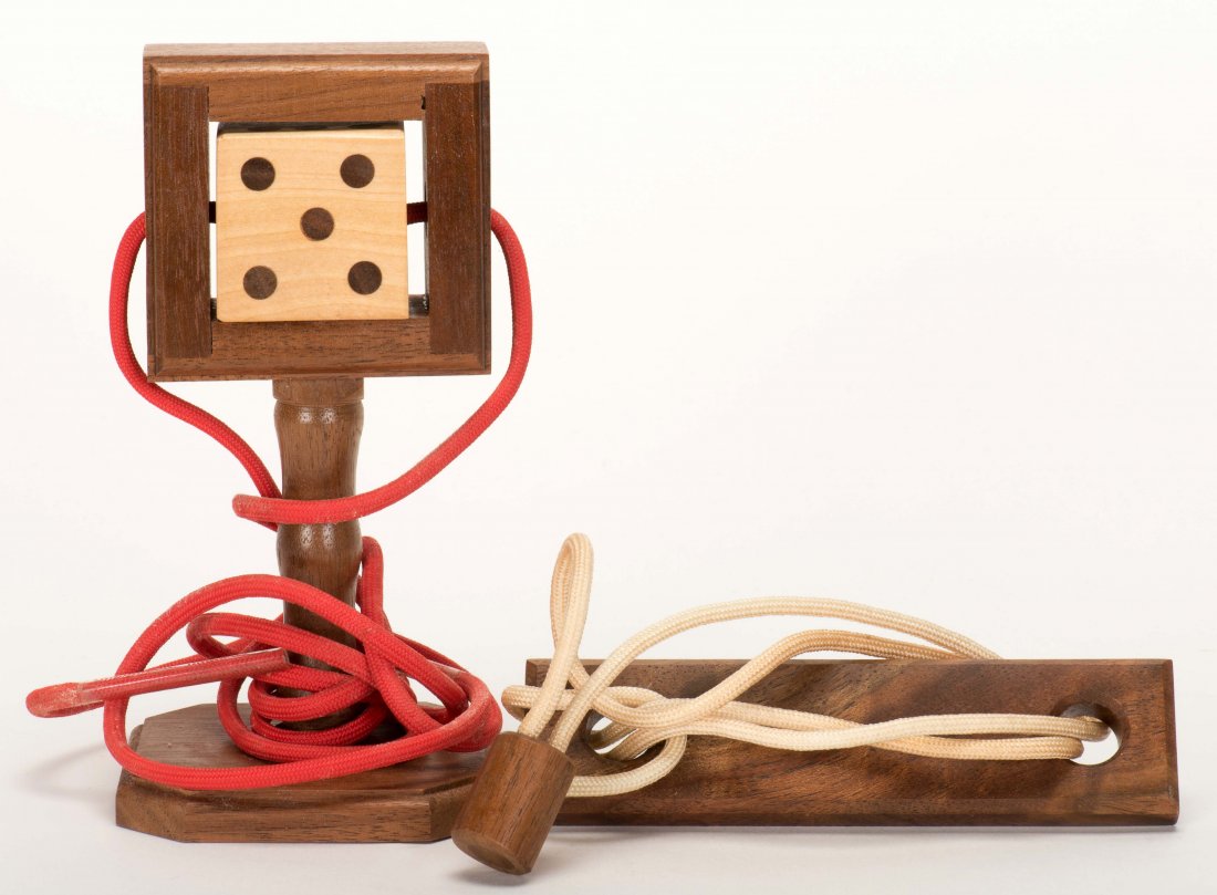 Two Babcock Die and Cord Tricks. Cashmere: Babcock,: Two Babcock Die and Cord Tricks. Cashmere: Babcock, 2000s. Two tricks for the release of wooden dice secured with cords running through their centers. Lacking instructions; very good.