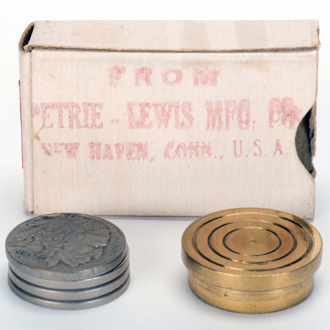 Four Nickels to Four Dimes. New Haven: Petrie & Lewis: Four Nickels to Four Dimes. New Haven: Petrie & Lewis (P&L), ca. 1930. Brass and aluminum holder (1" diam.) transforms nickels into dimes. In original box stamped "Petrie-Lewis Mfg." with a 1930 Buffa