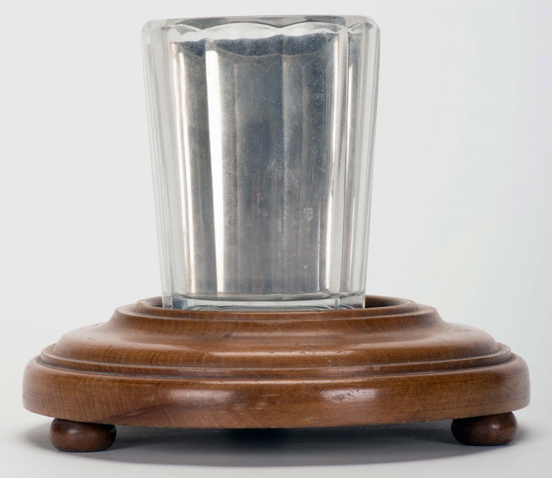 Turntable Stand. Indiana, PA: Bob Kline, ca. 1950.: Turntable Stand. Indiana, PA: Bob Kline, ca. 1950. Hardwood pedestal secretly rotates. Used in conjunction with a mirror glass. Includes Donald Holmes Mirror Glass. Modeled on the Thayer design. 7 ½"