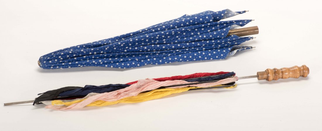 Parasol Illusion. Sweden: Tim Star, ca. 1990. Six silk: Parasol Illusion. Sweden: Tim Star, ca. 1990. Six silk handkerchiefs magically transpose with the cover of a small parasol. 24" long. With instructions. Good condition.