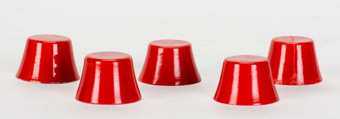 Chinka Chink. German, ca. 1930. Four miniature wooden: Chinka Chink. German, ca. 1930. Four miniature wooden cones visibly and magically transpose on the tabletop as the magician waves his hands over them. Metal shell. Paint worn on two cones. With origin